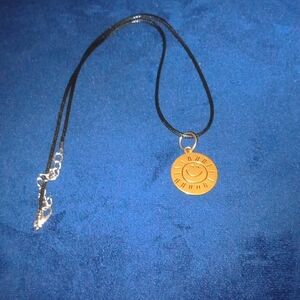 Gold Sun Pendant Necklace, With Black Leather Cord, New.